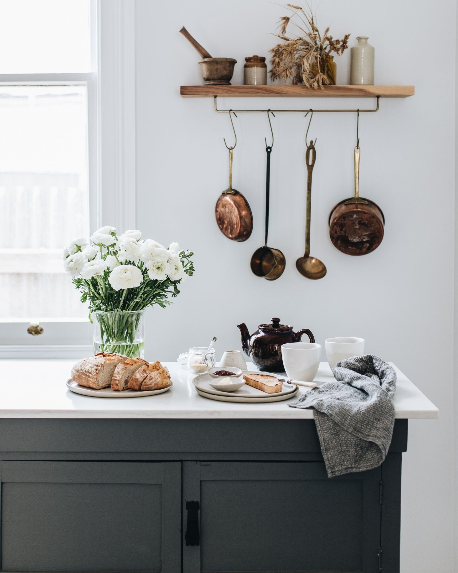 A bouquet of flowers on a kitchen benchtop 