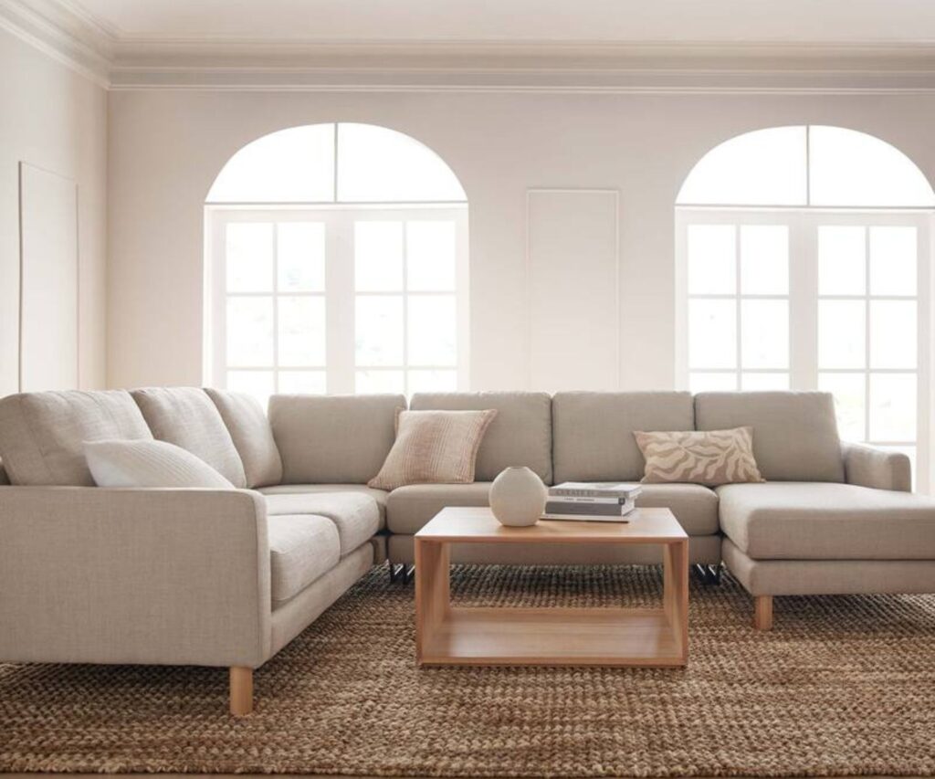 Cream corner sofa in light-filled living room