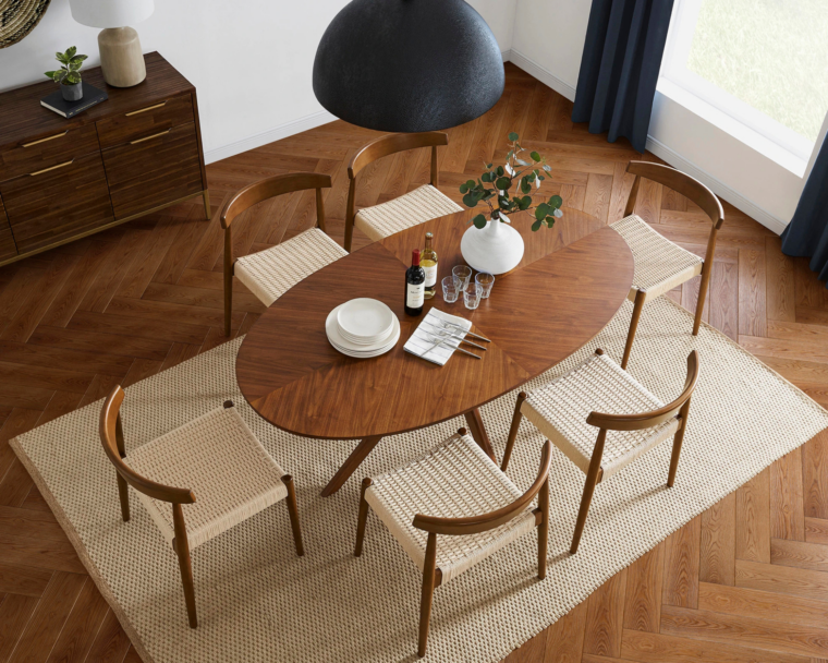 Castlery timber dining table on a beige rug