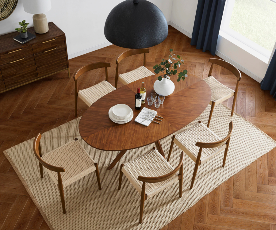 Castlery timber dining table on a beige rug