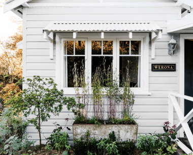 white weatherboard cottage facade exterior